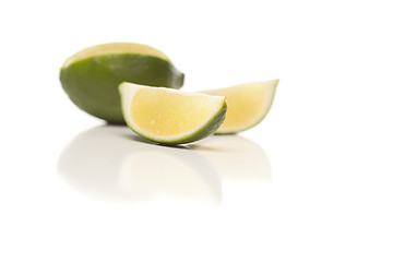 Image showing Sliced Lime on Reflective White Surface