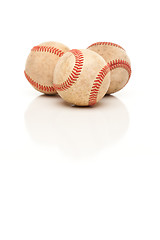 Image showing Three Baseballs Isolated on Reflective White