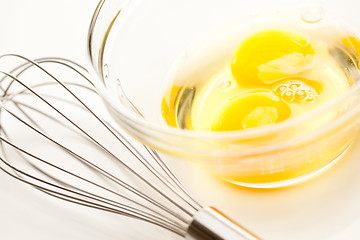 Image showing Hand Mixer with Eggs in Glass Bowl