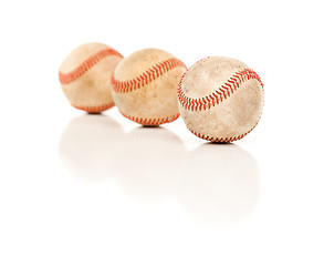 Image showing Three Baseballs Isolated on Reflective White