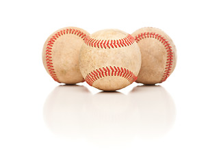 Image showing Three Baseballs Isolated on Reflective White