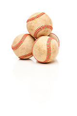 Image showing Four Baseballs Isolated on Reflective White
