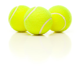 Image showing Three Tennis Balls on White with Slight Reflection