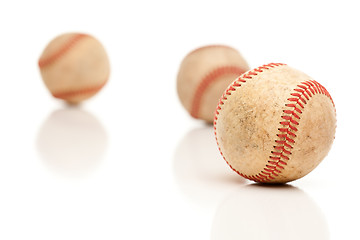 Image showing Three Baseballs Isolated on Reflective White