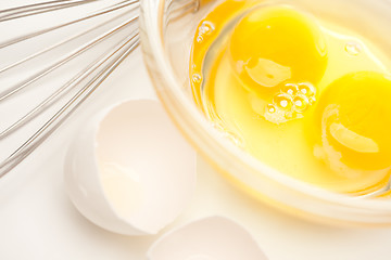 Image showing Hand Mixer with Eggs in Glass Bowl