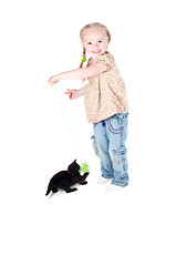 Image showing Little girl playing with kitten