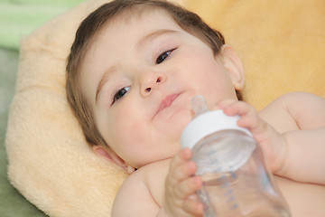 Image showing Baby with bottle closeup