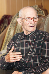 Image showing Senior man talking