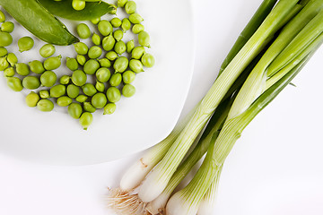 Image showing Fresh green peas and spring onion