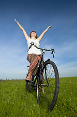 Image showing Girl with a bicycle