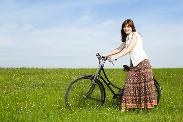 Image showing Girl with a bicycle