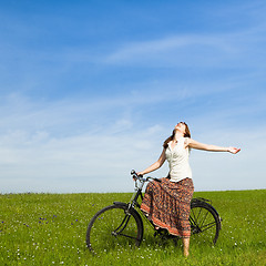 Image showing Girl with a bicycle