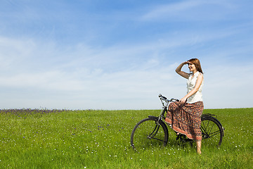 Image showing Girl with a bicycle