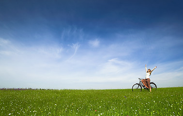 Image showing Girl with a bicycle