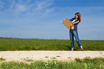 Image showing Hitch hiking girl