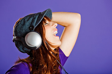 Image showing Beautiful woman listening music