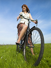 Image showing Girl with a bicycle