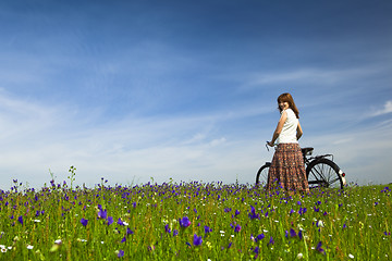 Image showing Girl with a bicycle