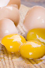 Image showing broken brown eggs