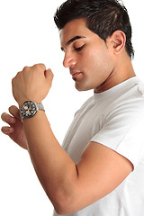 Image showing Man putting on chronograph watch