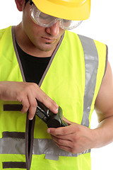 Image showing Builder with measuring device