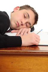 Image showing Tired bored student at desk