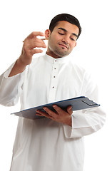 Image showing Middle eastern business man writing