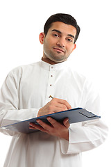 Image showing Ethnic businessman writing
