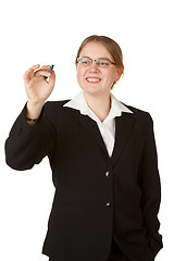 Image showing young business woman with marker isolated on white