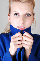 Image showing Pretty lady in blue coat.