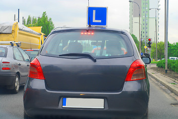 Image showing a car going down the street