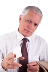 Image showing Portrait of a mature  businessman, with blank business card in hand