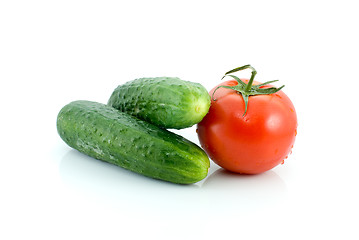 Image showing Single tomato and pair of cucumbers
