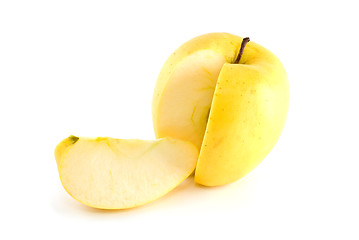 Image showing Yellow apple with piece cut