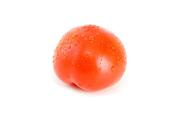 Image showing Single ripe tomato with drops of water