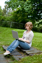 Image showing Young female with laptop