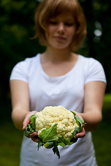 Image showing Girl holding a fresh cauliflower