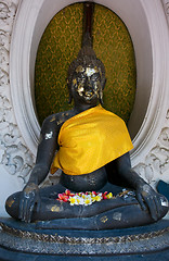 Image showing Buddha image with flowers in Nakhon Pathom, Thailand.