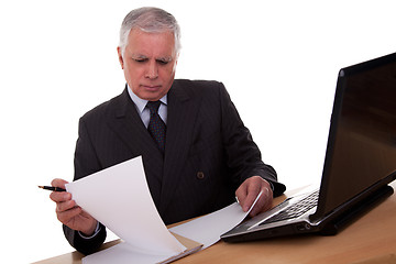 Image showing mature businessman  looking to computer