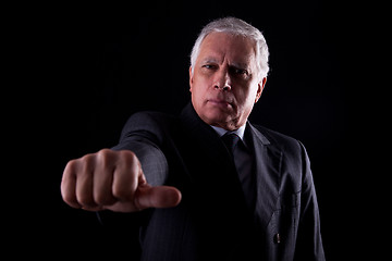 Image showing old businessman with a hand with thumbs middle 