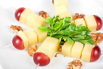 Image showing Cheese and grapes and nuts