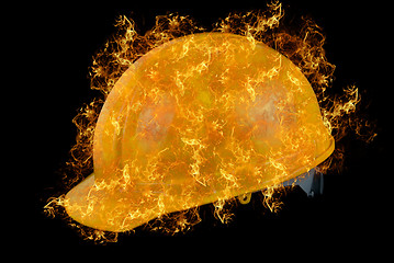 Image showing Yellow helmet at fire