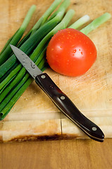 Image showing Tomato, scallions and knife