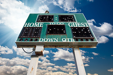 Image showing HIgh School Scoreboard Over Blue Sky with Clouds