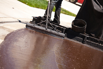 Image showing Road Worker Resurfacing Street