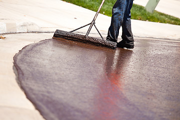 Image showing Road Worker Resurfacing Street