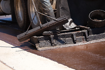 Image showing Road Worker Resurfacing Street