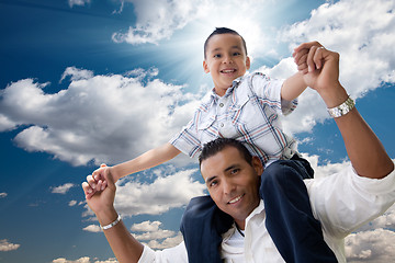 Image showing Hispanic Father and Son Having Fun Over Clouds