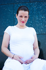 Image showing Beautiful young pregnant girl smiling