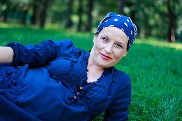 Image showing Beautiful young pregnant woman in nature couched